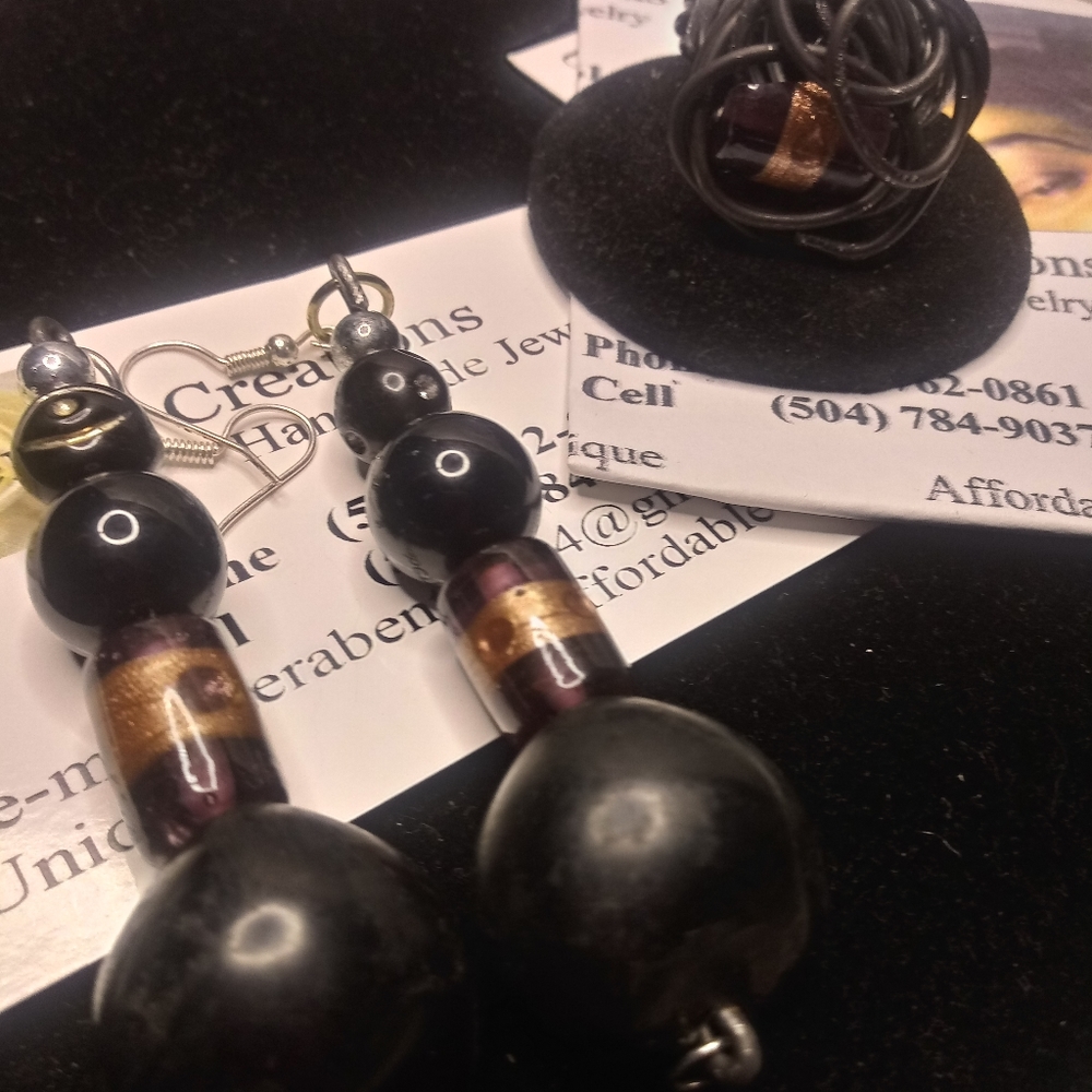A ring and a pair of earrings the ring size 8